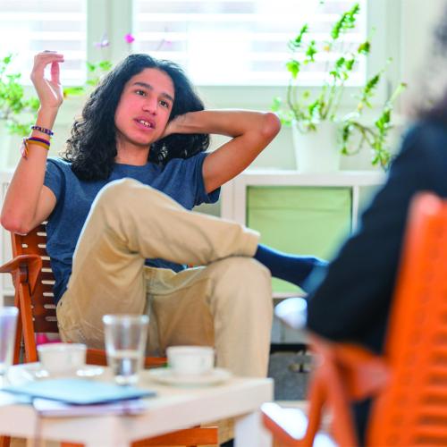 ending homelessness young man sitting on chair